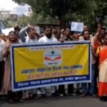 धनबाद में साक्षरता कर्मियों का पैदल मार्च, बकाया मानदेय और समायोजन की मांग !